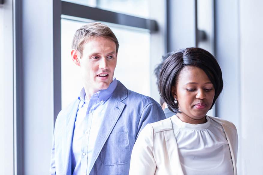 Man looking at woman of different race - Employment Law